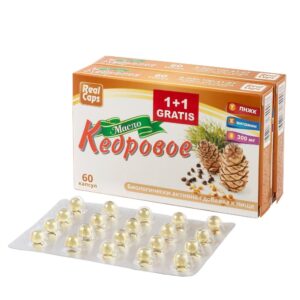 na fotografiji se nalaze dva pakovanja kedrovog ulja u kapsulama što simboliše 1+1 gratis, ispred kutija je tabla sa kapsulama